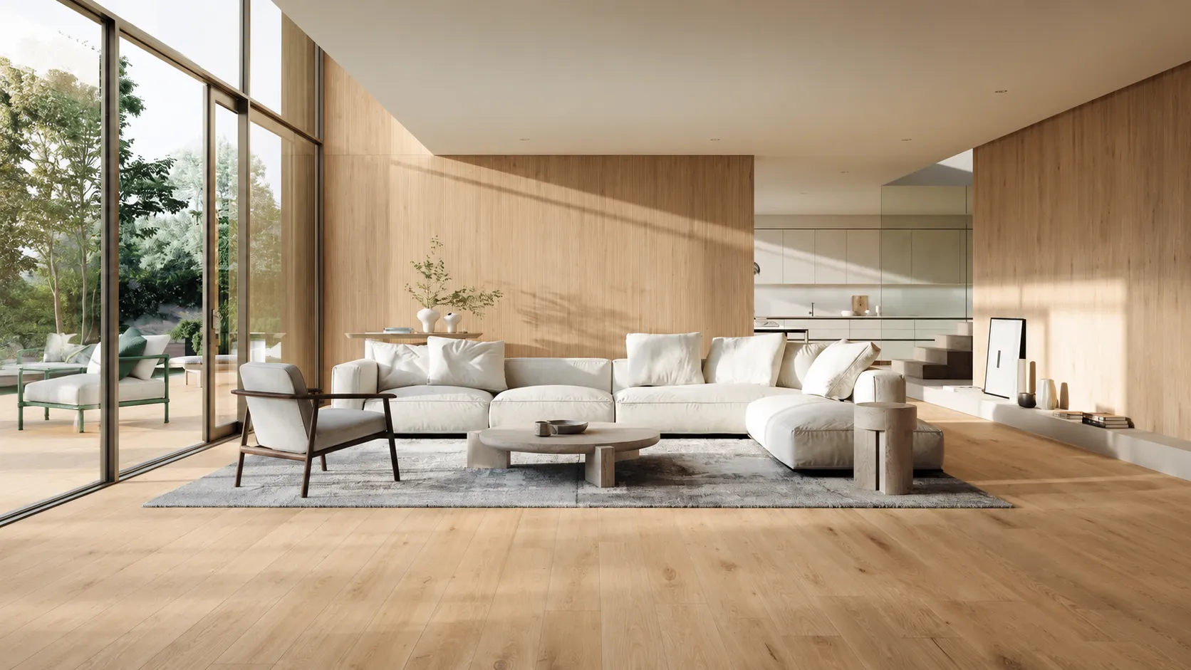 Soggiorno luminoso con pavimento in gres porcellanato effetto legno rovere e grandi vetrate.