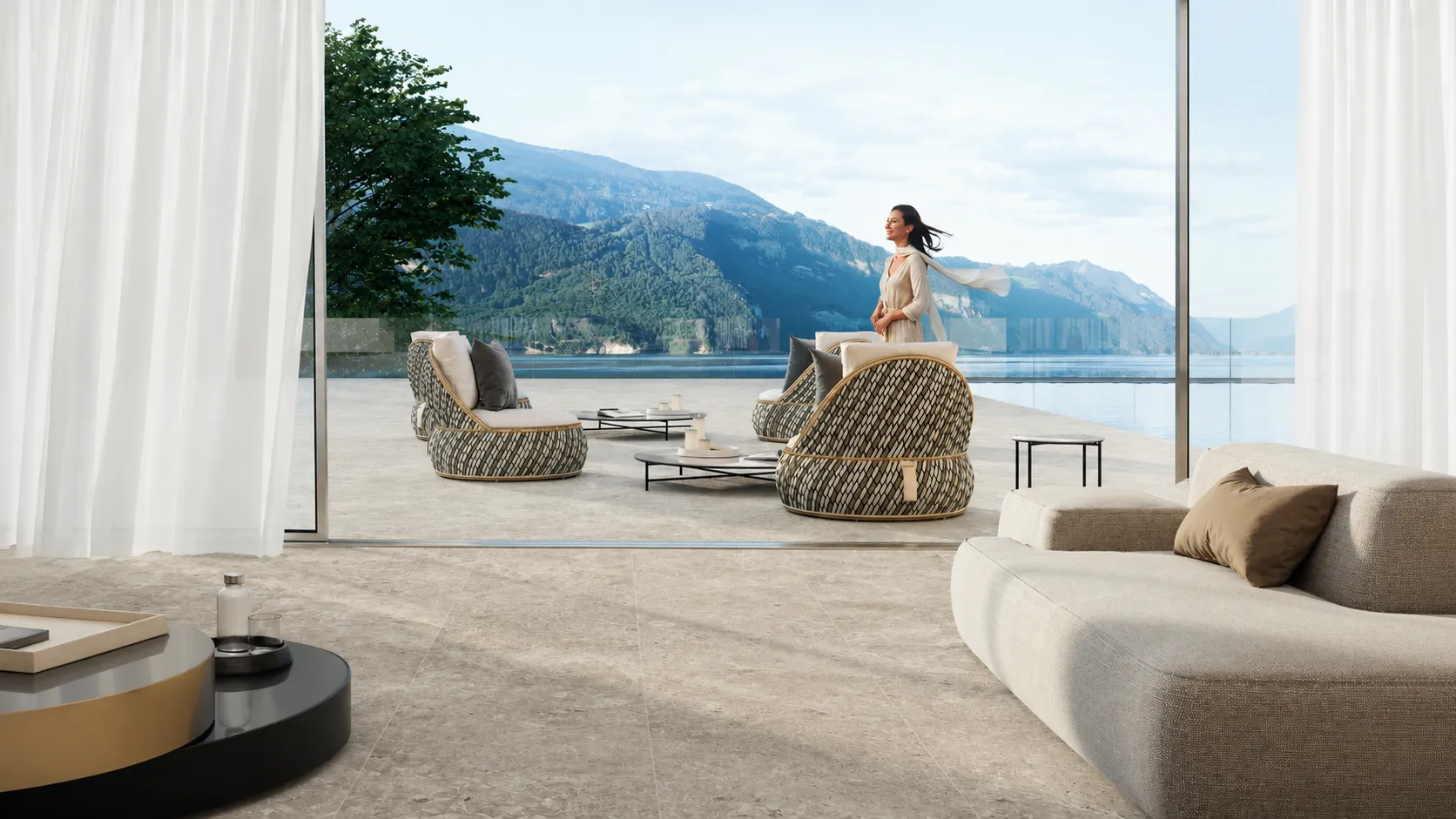 Living di lusso con pavimento in gres effetto pietra coordinato tra interno e terrazza panoramica.